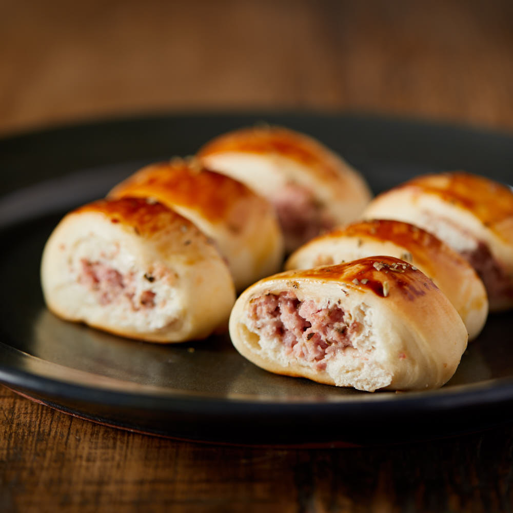 Cento de Enroladinho de Presunto e Queijo